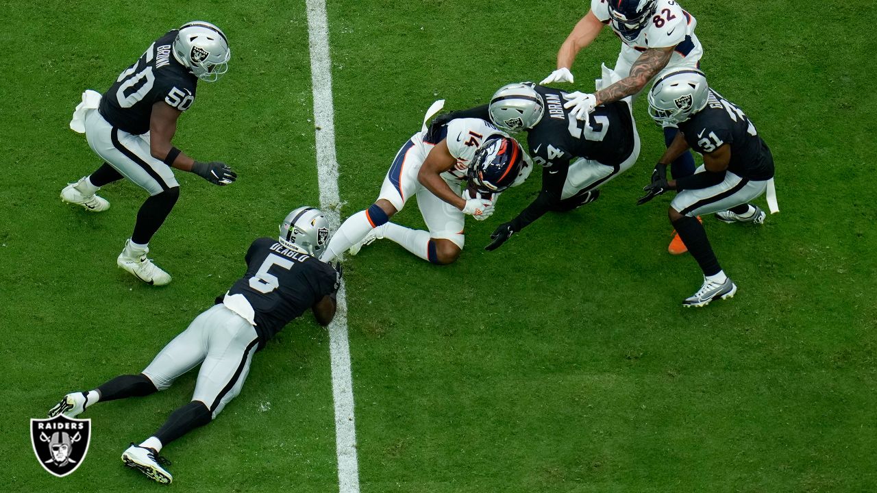 Raiders use defense to slay division rival Broncos 30-20 to top AFC West