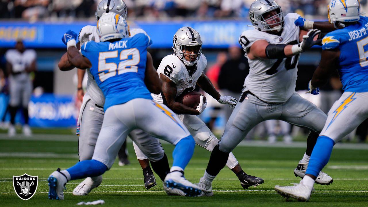 Las Vegas Raiders vs. Los Angeles Chargers. NFL Game. American Football  League match. Silhouette of professional player celebrate touch down.  Screen i Stock Photo - Alamy