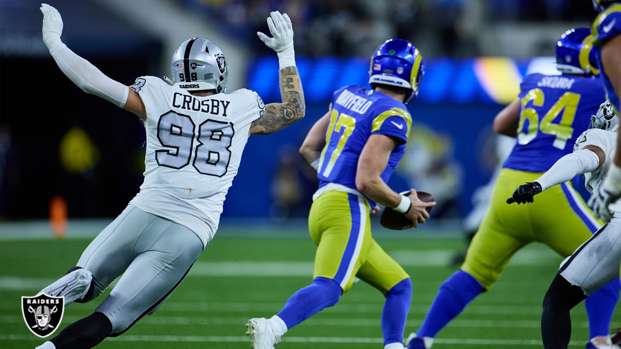 Oakland Raiders defensive end Maxx Crosby (98) gestures after being  penalized for roughing the …