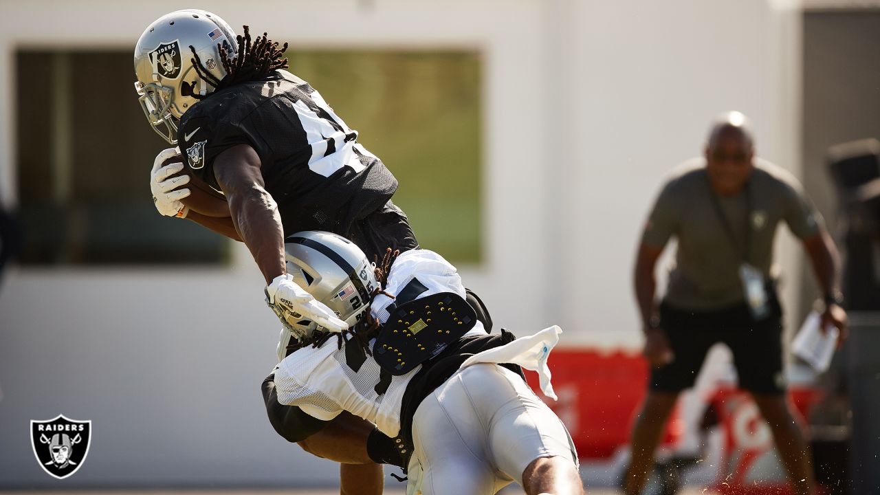 Las Vegas Raiders fullback Alec Ingold (45) hurdles New England Patriots  defensive back J.C. Ja …