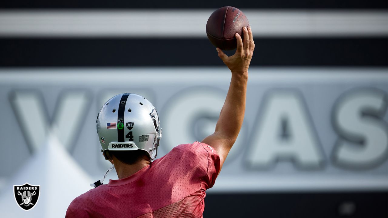 Las Vegas Raiders quarterback Chase Garbers (15) throws the ball on the  field before an NFL