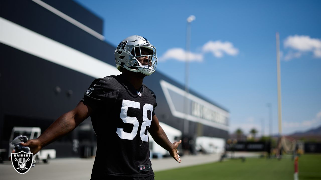 Las Vegas Raiders cornerback Amik Robertson (21) takes a drink during a  practice session at the …