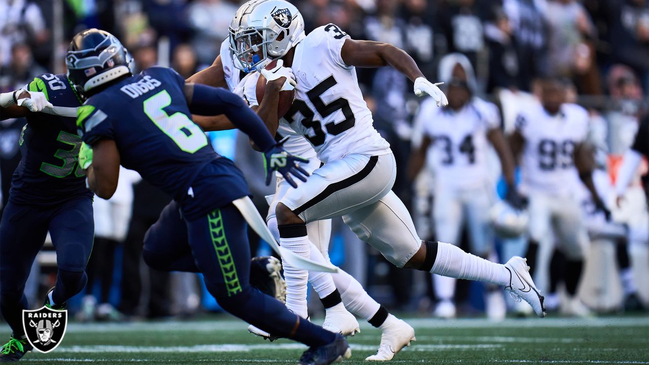 Las Vegas Raiders cornerback Amik Robertson (21) tackles Seattle Seahawks  tight end Cam Sutton (46) during the second half of an NFL preseason  football game, Saturday, Aug. 14, 2021, in Las Vegas. (