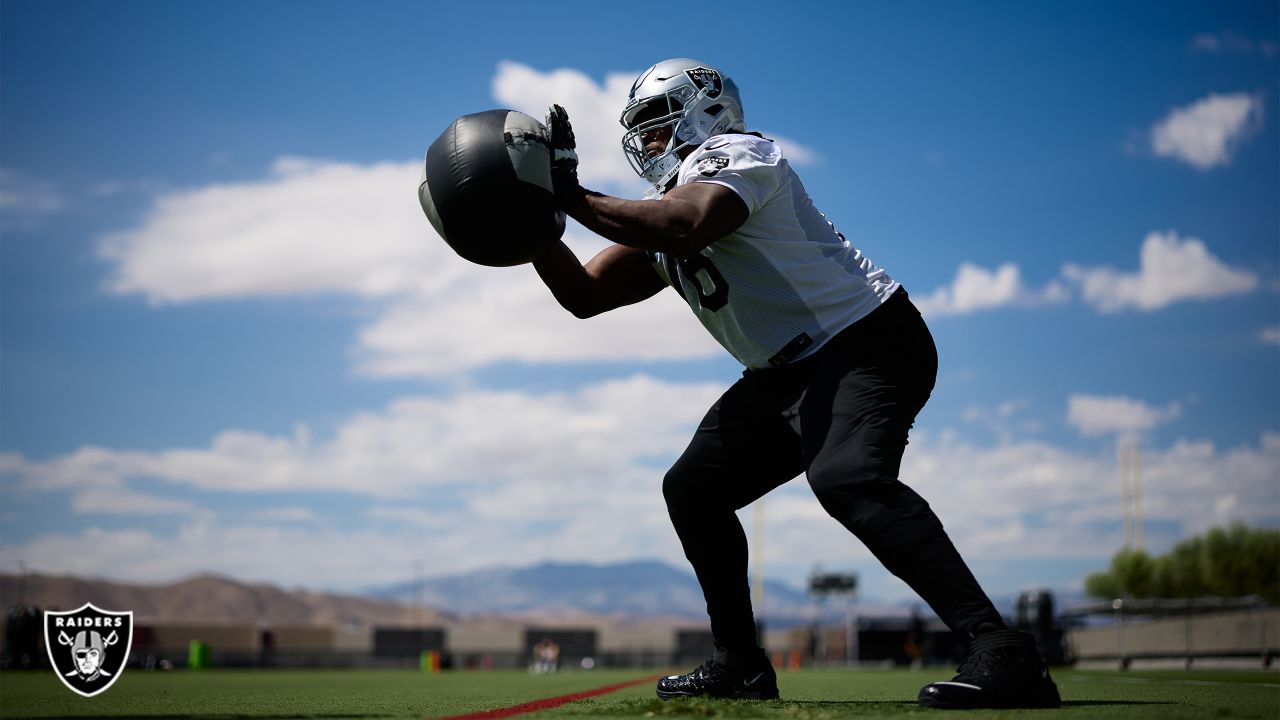 Las Vegas Raiders cornerback Amik Robertson (21) takes a drink during a  practice session at the …