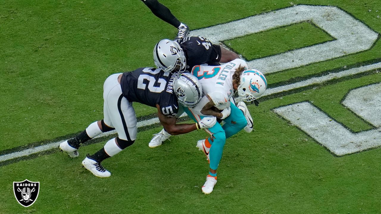 Raiders inside linebacker Cory Littleton (42) stops Miami Dolphins