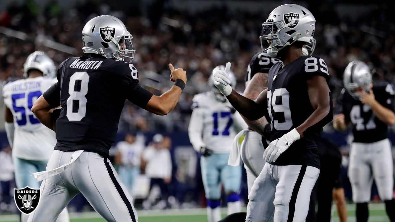 Las Vegas Raiders quarterback Aidan O'Connell (4) gestures as he warms up  before the first half of a preseason NFL football game against the Dallas  Cowboys in Arlington, Texas, Saturday, Aug. 26