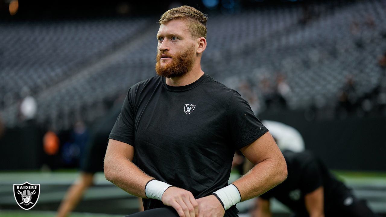 Las Vegas Raiders tight ends Cole Fotheringham (85), Nick Bowers (82), and  Jesper Horsted (80) talk against the New England Patriots during the first  half of an NFL preseason football game, Friday