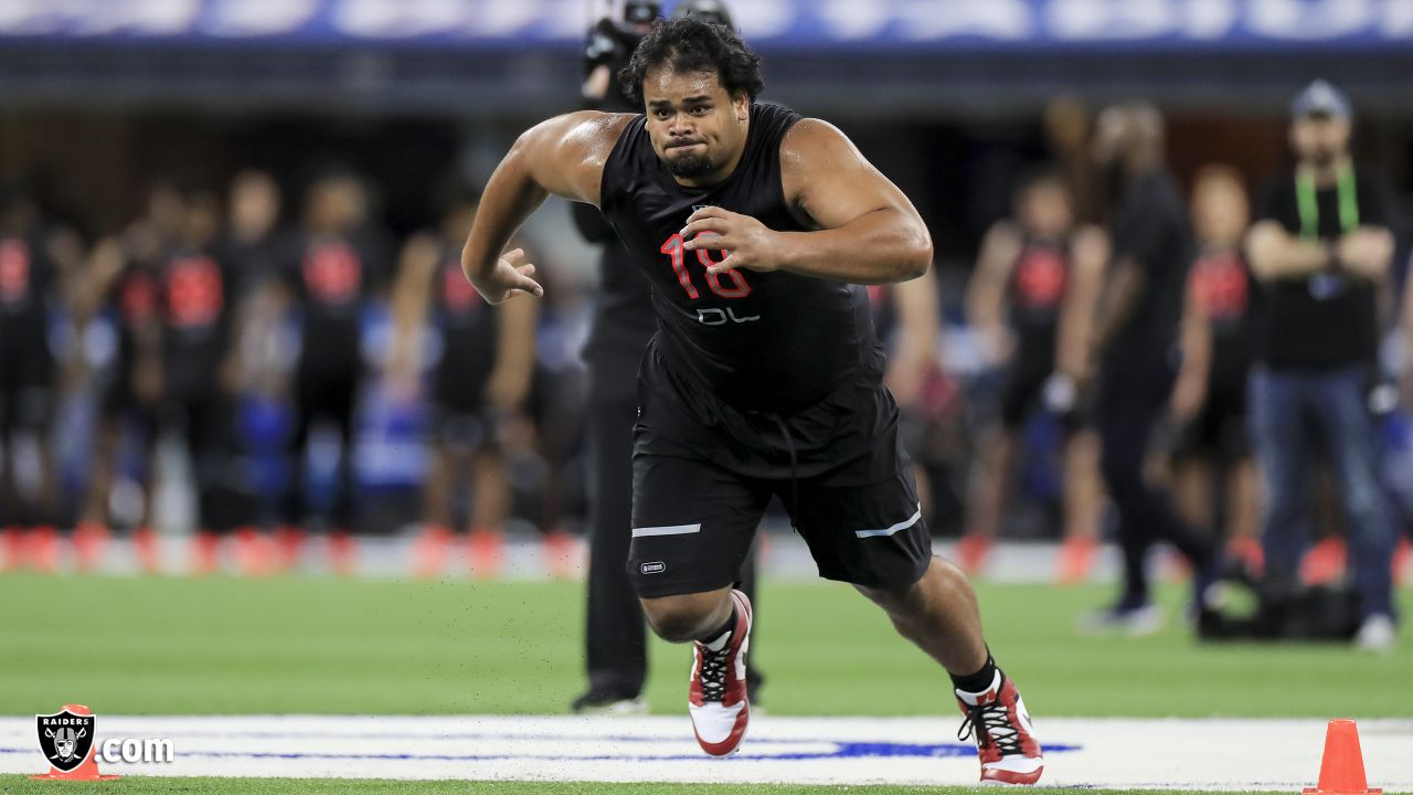 Utah defensive lineman John Penisini runs a drill at the NFL