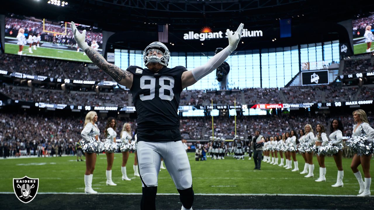 Las Vegas Raiders defensive end Maxx Crosby (98) salutes the crowd in the  first half during an …