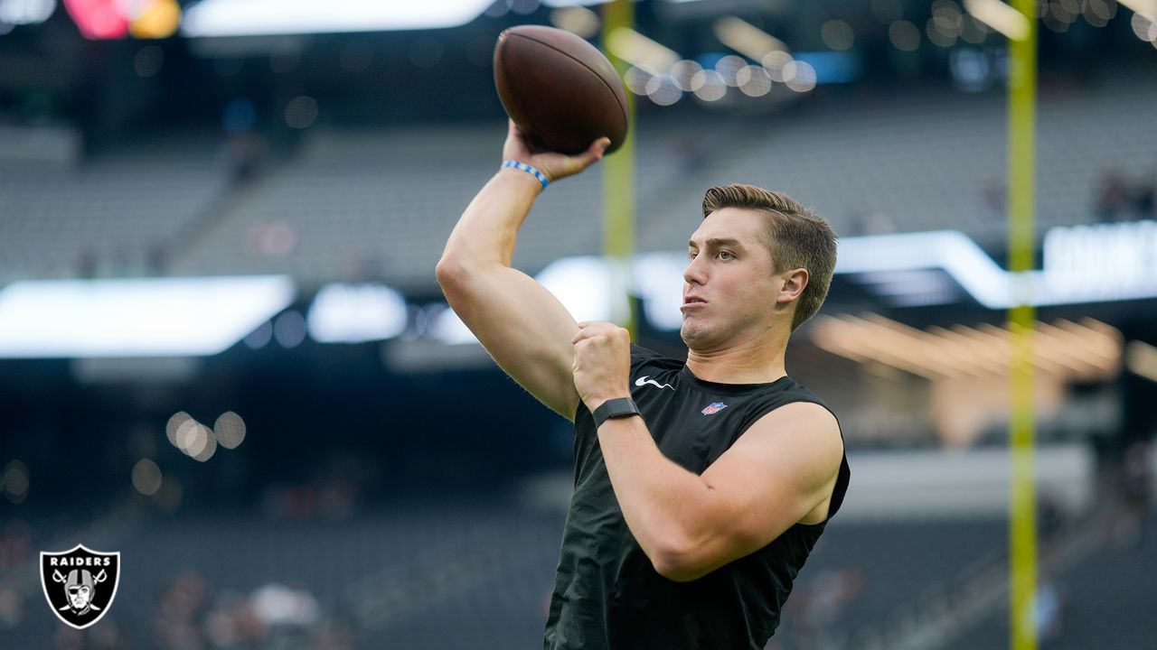 Las Vegas Raiders quarterback Chase Garbers (15) throws the ball on the  field before an NFL