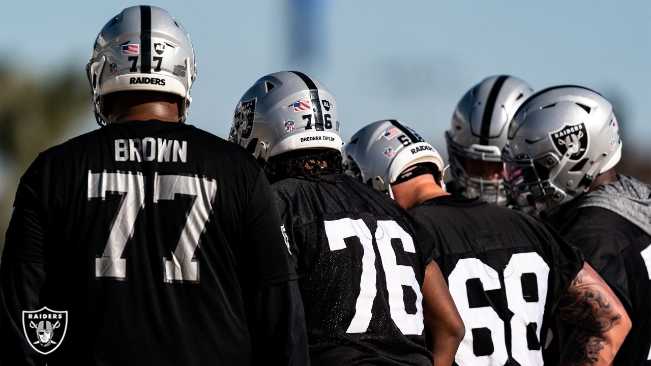 Las Vegas Raiders offensive guard John Simpson (76, left) and offensive  tackle Andre James (68) …