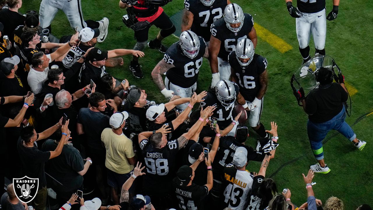 Raiders fans celebrate after beating the Pittsburgh Steelers at