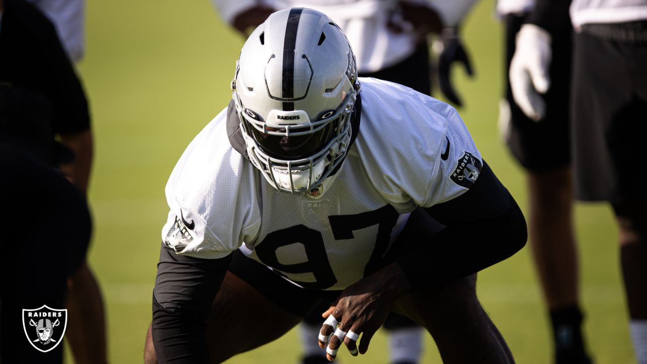 Defensive end Clelin Ferrell (99) grabs some air during a Las Vegas Raiders  open practice at th …