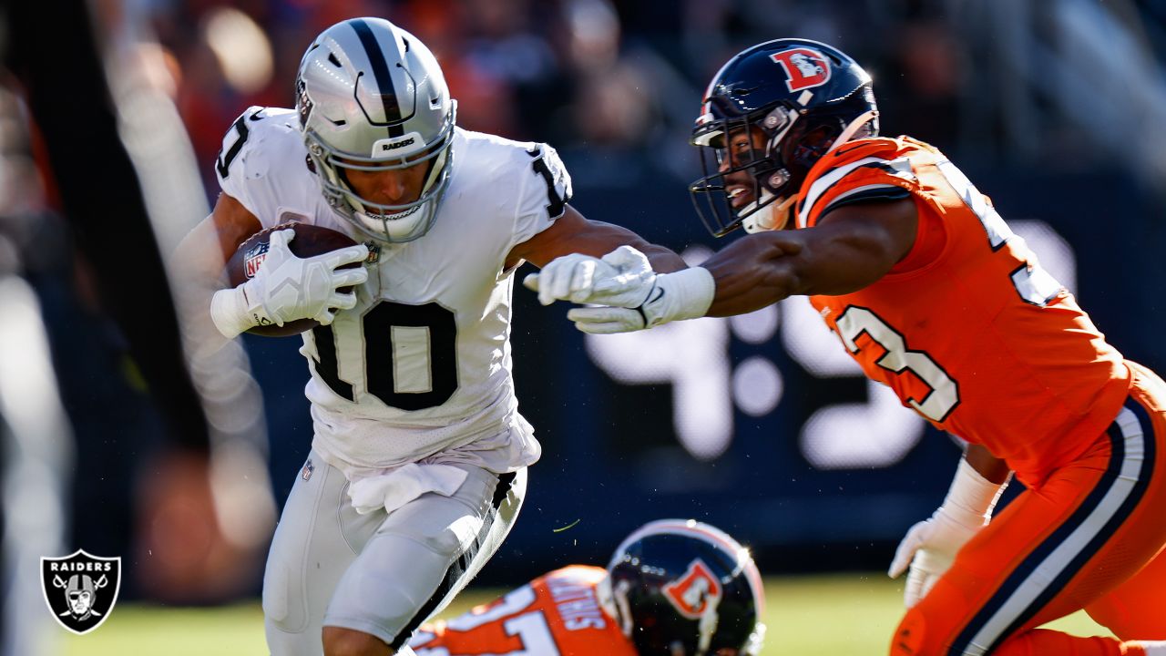 PHOTOS: Broncos take on Raiders in regular season opener in Oakland