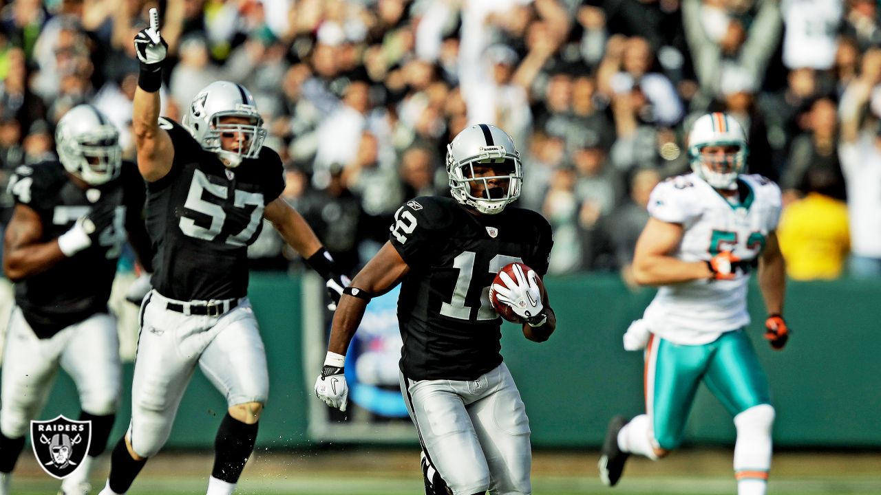 Oakland, California, USA. 31st Oct, 1999. Oakland Raiders vs. Miami Dolphins  at Oakland Alameda County Coliseum Sunday, October 31, 1999. Dolphins beat  Raiders 16-9. Miami Dolphins defensive end Rich Owens (96) and