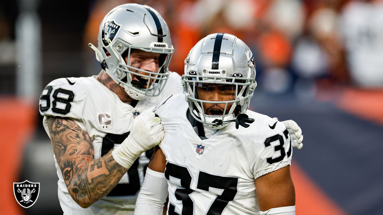 Denver Broncos kicker Brandon McManus (8) talks with Raiders