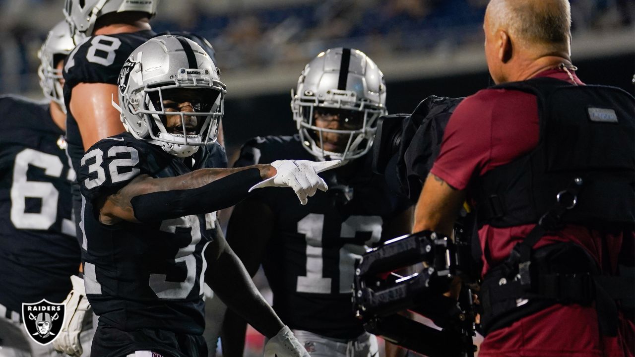 Las Vegas Raiders running back Austin Walter (32) reacts after scoring a  touchdown during an NFL