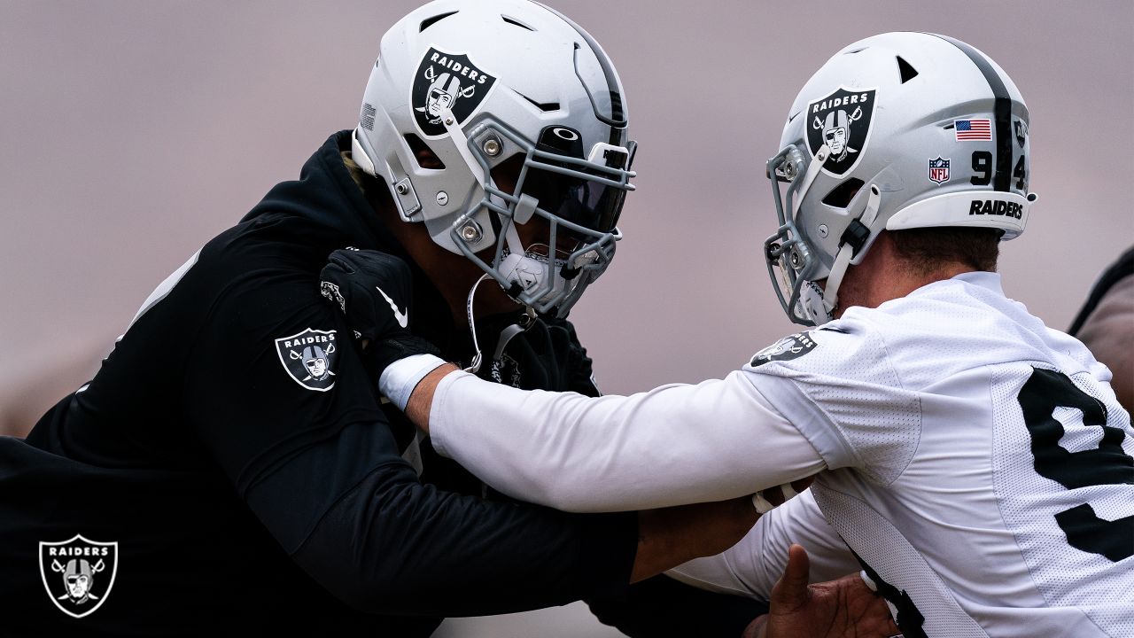 Las Vegas Raiders offensive tackle Trent Brown (77) warms up with a mask on  during a practice …