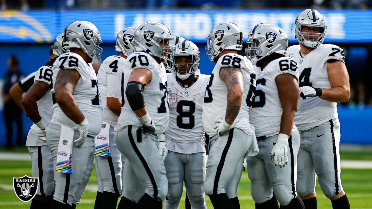 Los Angeles Chargers huddle during an NFL football game against