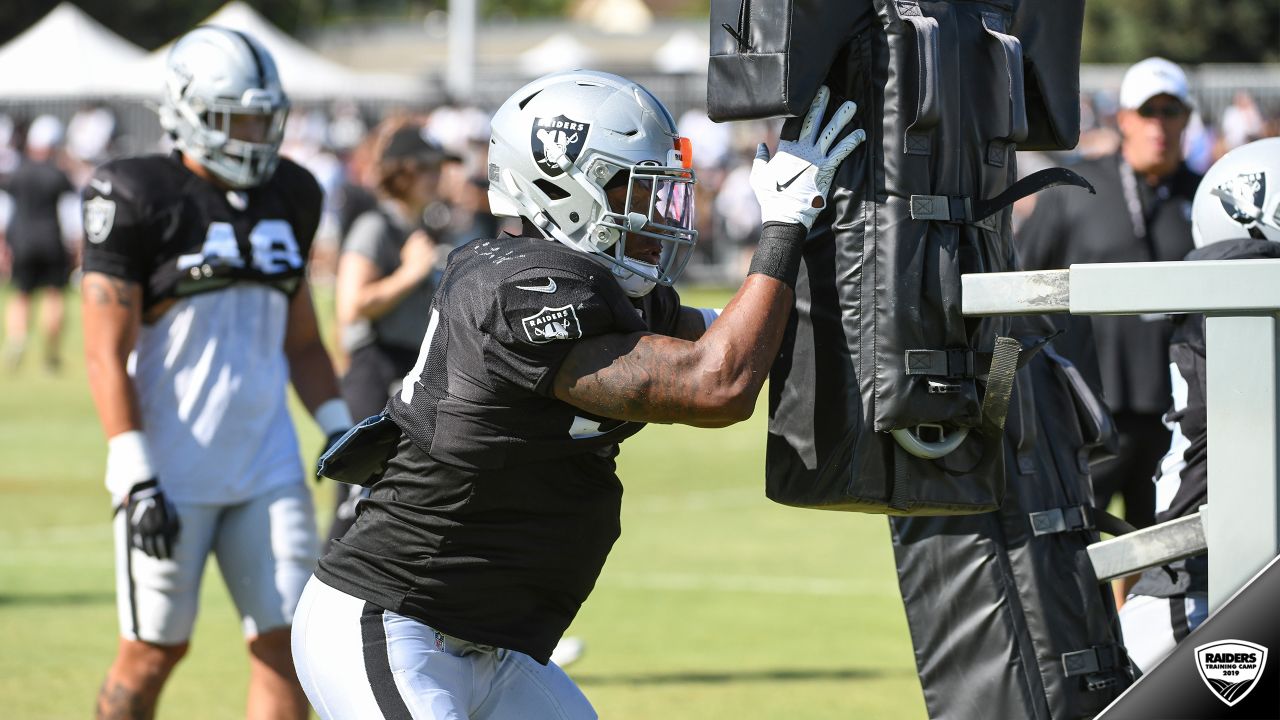 Oakland Raiders offensive guard Jordan Devey (65), center Richie Incognito ( 64), and offensive …