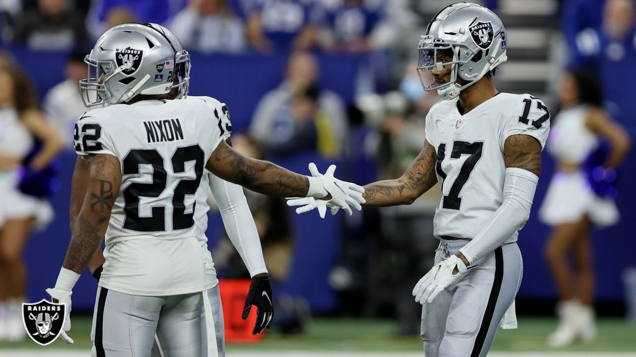 Las Vegas Raiders wide receiver Hunter Renfrow #13 is helped off the field  after suffering a bi …