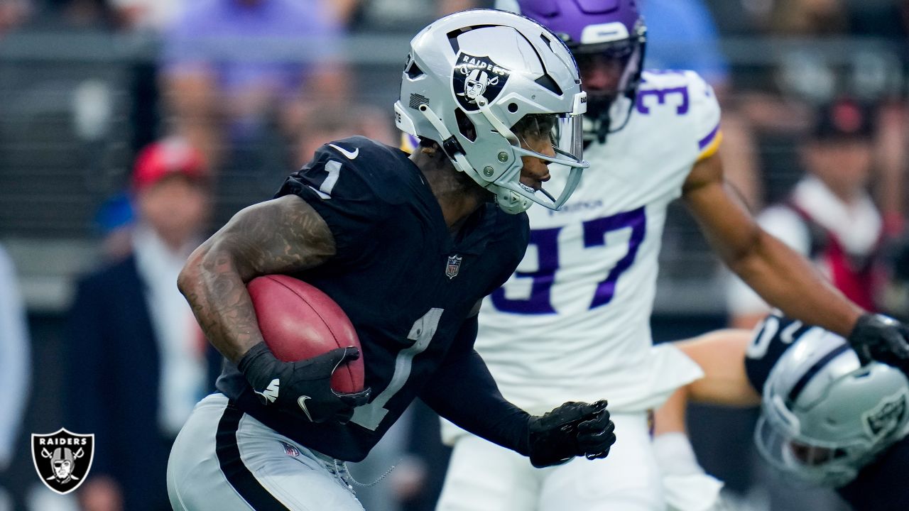 Minnesota Vikings linebacker Luiji Vilain jumps over Las Vegas Raiders  quarterback Jarrett Stidham during the first half of an NFL preseason  football game, Sunday, Aug. 14, 2022, in Las Vegas. (AP Photo/Rick