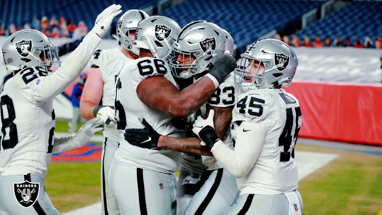 Darren Waller of the Las Vegas Raiders celebrates a touchdown with