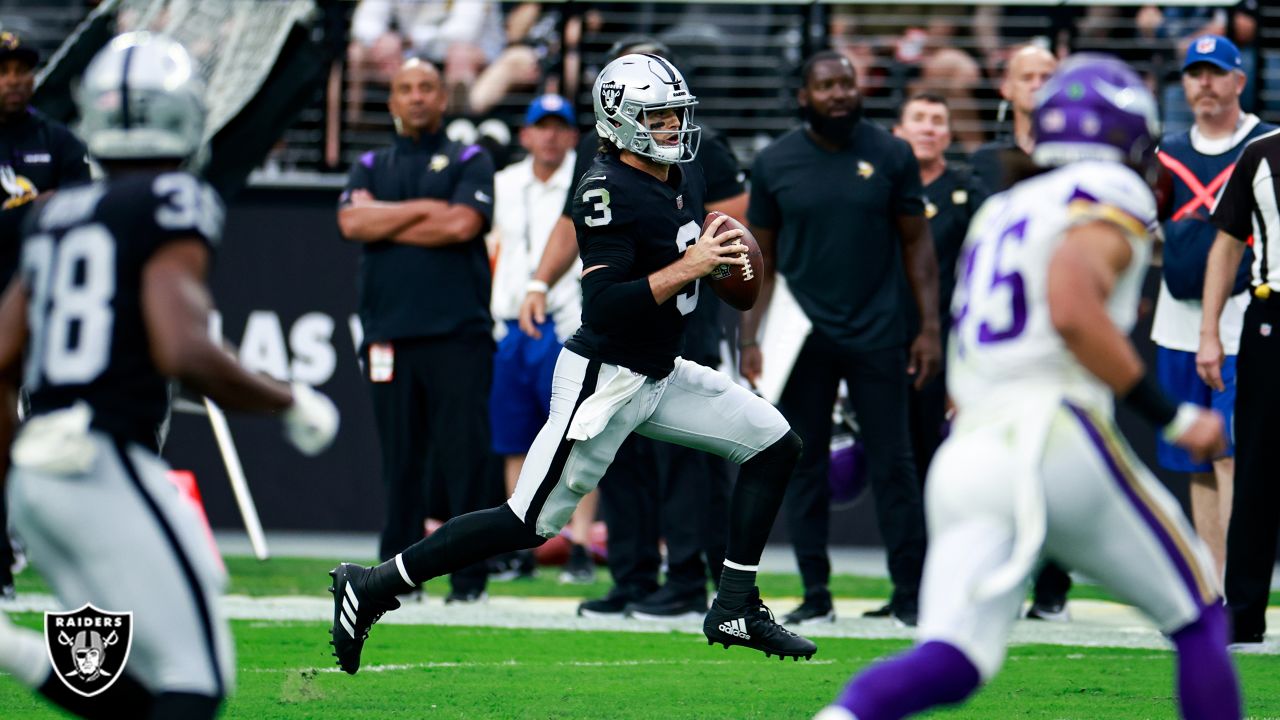 Minnesota Vikings linebacker Luiji Vilain jumps over Las Vegas Raiders  quarterback Jarrett Stidham during the first half of an NFL preseason  football game, Sunday, Aug. 14, 2022, in Las Vegas. (AP Photo/Rick