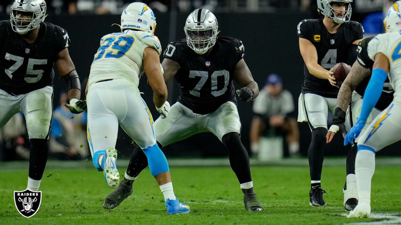 Las Vegas Raiders' Tyron Johnson (17) runs against the Los Angeles Chargers  during the first half of an NFL football game, Sunday, Jan. 9, 2022, in Las  Vegas. (AP Photo/Ellen Schmidt Stock