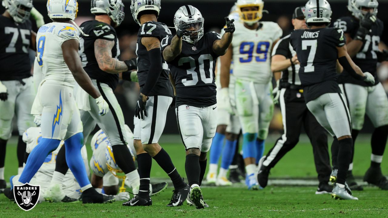 Las Vegas Raiders wide receiver Tyron Johnson (1) runs with the ball during  an NFL football game against the Miami Dolphins, Saturday, Aug. 20, 2022,  in Miami Gardens, Fla. (AP Photo/Doug Murray