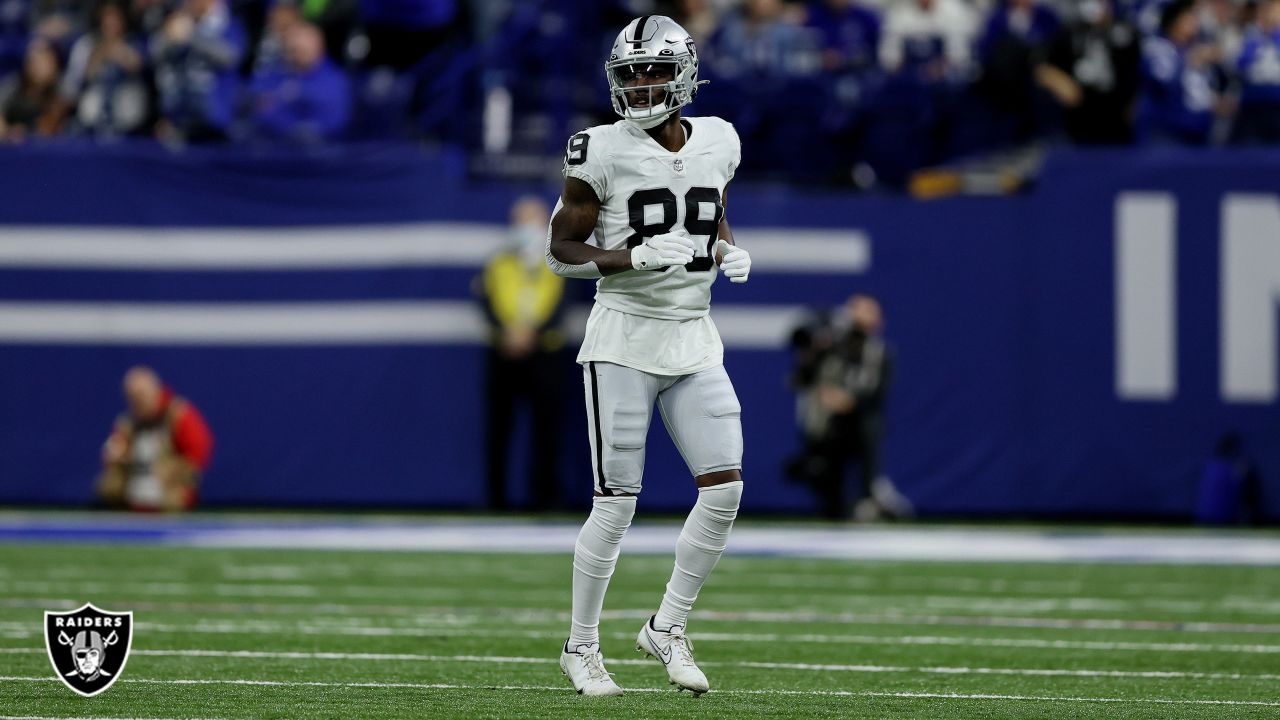 Las Vegas Raiders wide receiver Hunter Renfrow #13 is helped off the field  after suffering a bi …