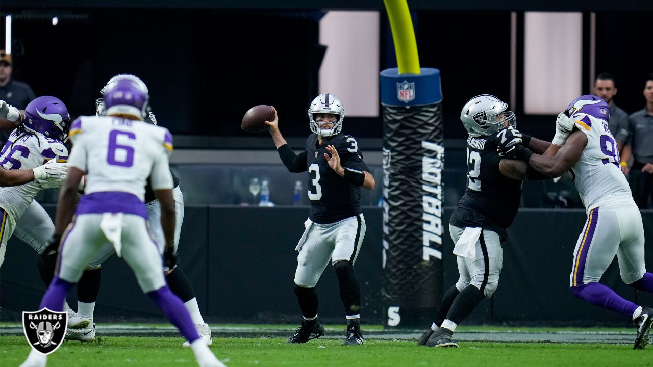 Las Vegas Raiders quarterback Jarrett Stidham is tackled by Minnesota  Vikings defensive tackle T.Y. McGill during the first half of an NFL  preseason football game, Sunday, Aug. 14, 2022, in Las Vegas. (