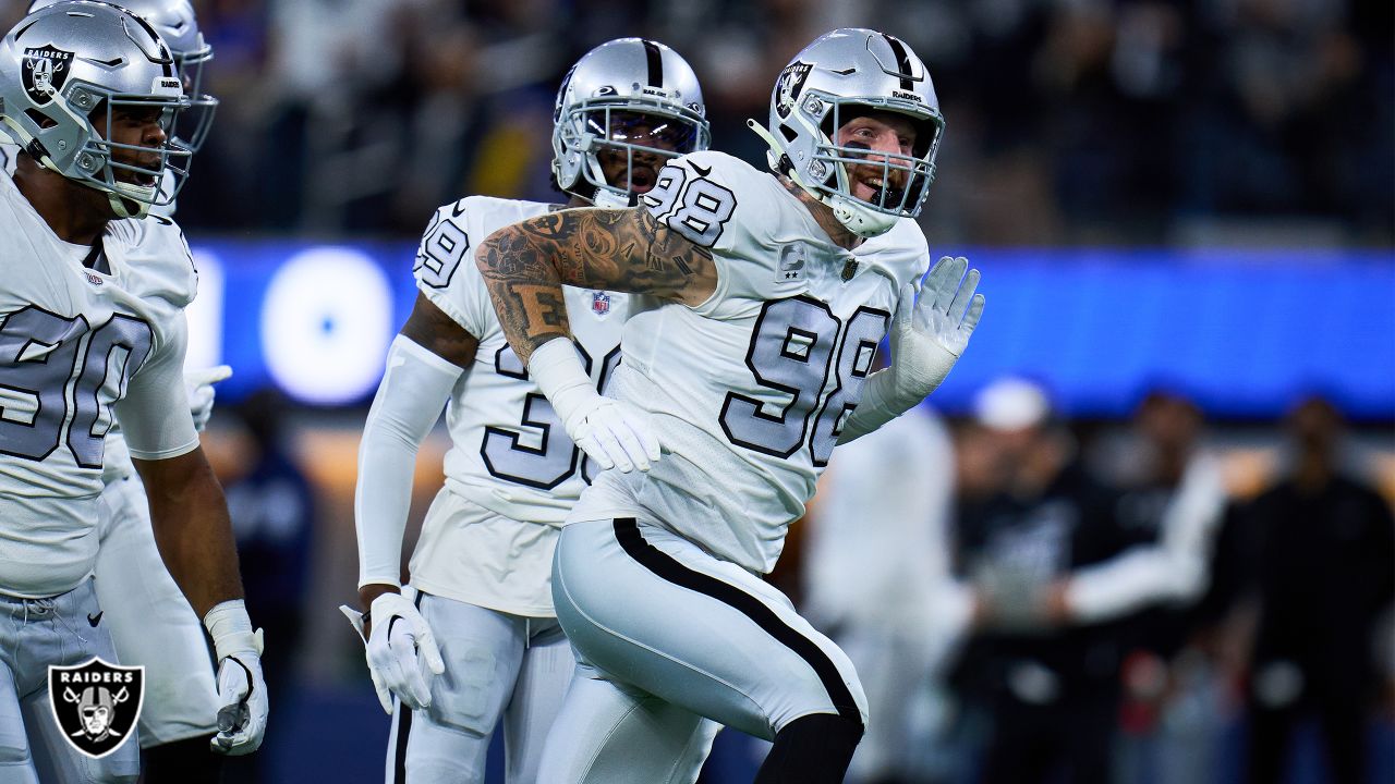 Oakland Raiders defensive end Maxx Crosby (98) gestures after being  penalized for roughing the …