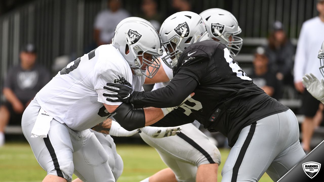 Oakland Raiders offensive guard Jordan Devey (65), center Richie Incognito  (64), and offensive …