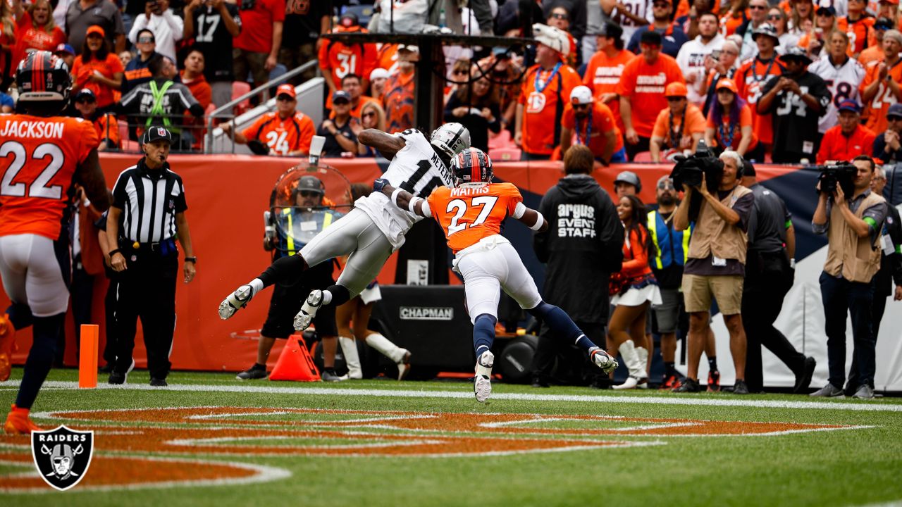 Denver Broncos vs. Las Vegas Raiders. NFL Game. American Football League  match. Silhouette of professional player celebrate touch down. Screen in  back Stock Photo - Alamy