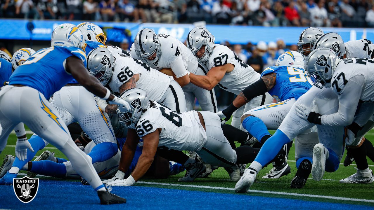 Las Vegas Raiders quarterback Aidan O'Connell (4) hands the ball