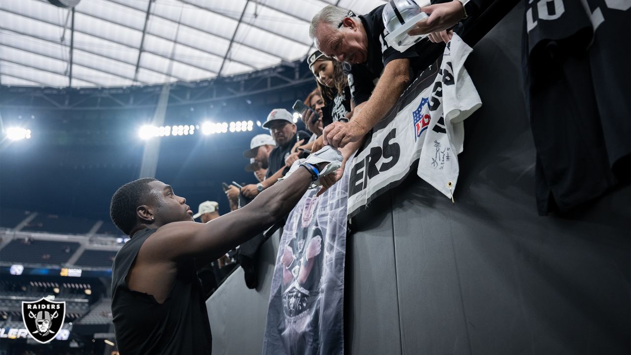 Raiders fans celebrate after beating the Pittsburgh Steelers at