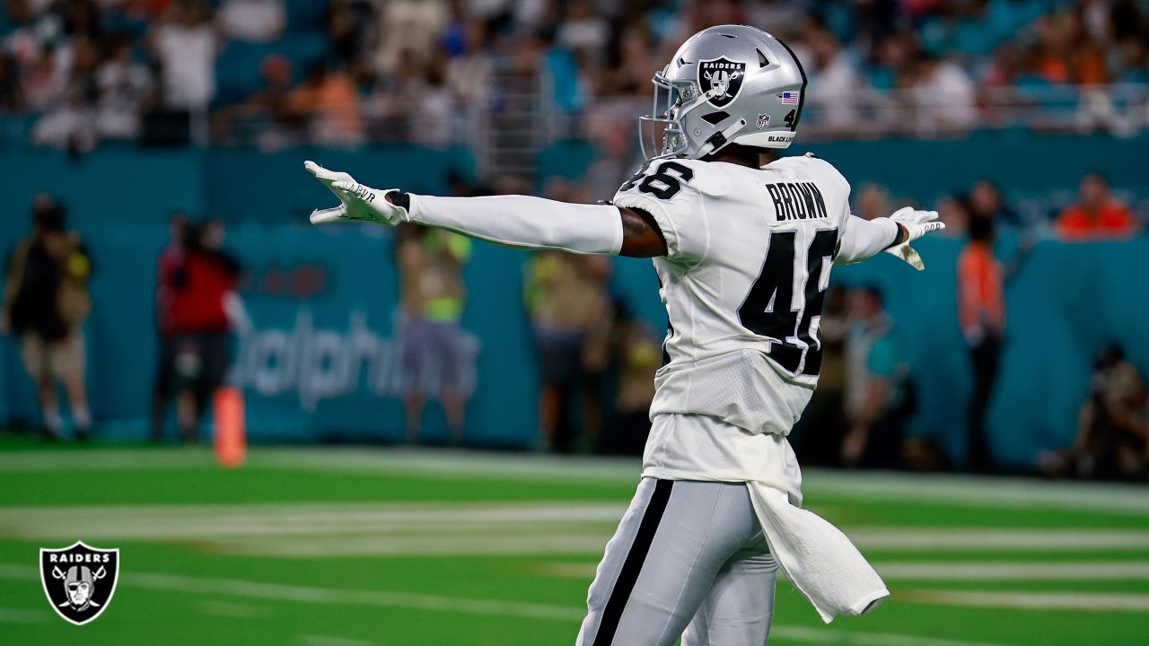 Las Vegas Raiders cornerbacks Sam Webb (48) and Isiah Brown (46) celebrate  after the Miami Dolphins missed a field goal during the second half of a  NFL preseason football game, Saturday, August