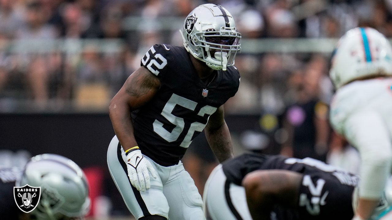 Las Vegas Raiders defensive end Clelin Ferrell (99) looks on as linebacker  Denzel Perryman (52) …