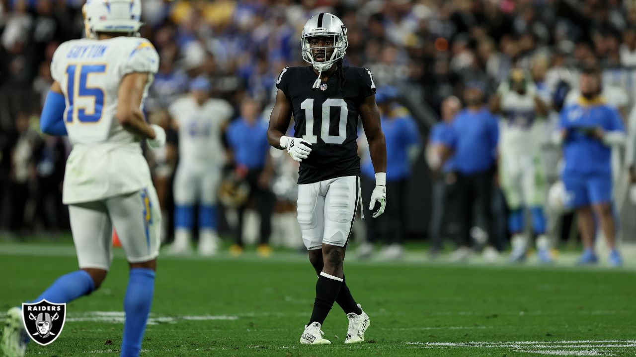 Las Vegas Raiders' Tyron Johnson (17) runs against the Los Angeles Chargers  during the first half of an NFL football game, Sunday, Jan. 9, 2022, in Las  Vegas. (AP Photo/Ellen Schmidt Stock