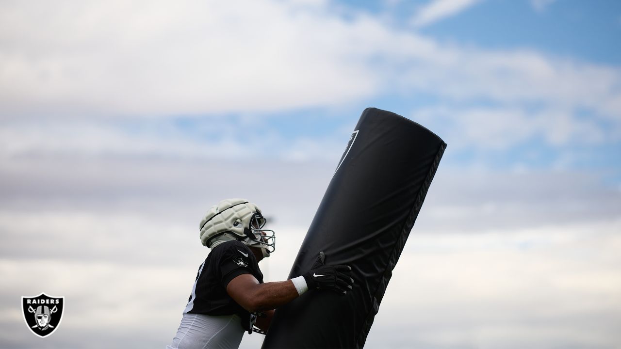 Raiders safety Trevon Moehrig (25) makes a leaping catch during a special  training camp practic …