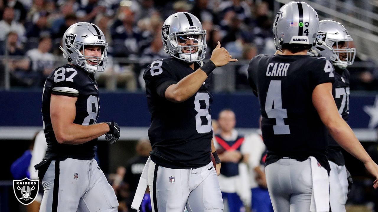 Las Vegas Raiders quarterback Aidan O'Connell (4) gestures as he warms up  before the first half of a preseason NFL football game against the Dallas  Cowboys in Arlington, Texas, Saturday, Aug. 26