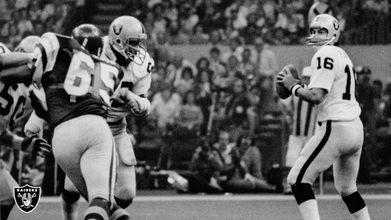 Oakland Raiders quarterback Jim Plunkett takes a snap during the playoff  game between the Cleveland Browns and the Oakland Raiders at Cleveland  Stadium on Jan. 4, 1981. Gene Upshaw is number 63