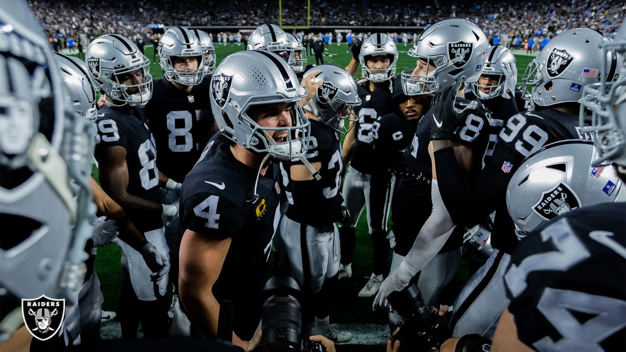 Raiders cornerback Keisean Nixon (22) and teammate quarterback Derek Carr  (4) walk off the fiel …