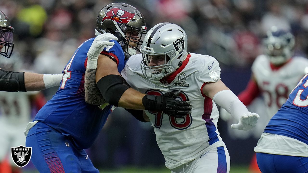 AFC defensive end Maxx Crosby of the Las Vegas Raiders (98) celebrates  after a play against the NFC during the Pro Bowl NFL football game, Sunday,  Feb. 6, 2022, in Las Vegas. (