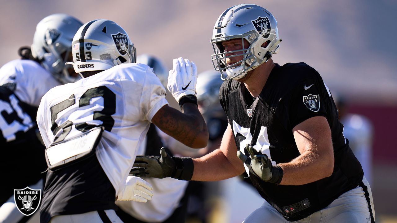 Raiders tight end Foster Moreau (87) is tackled by Raiders linebacker Javin  White (53) during a …