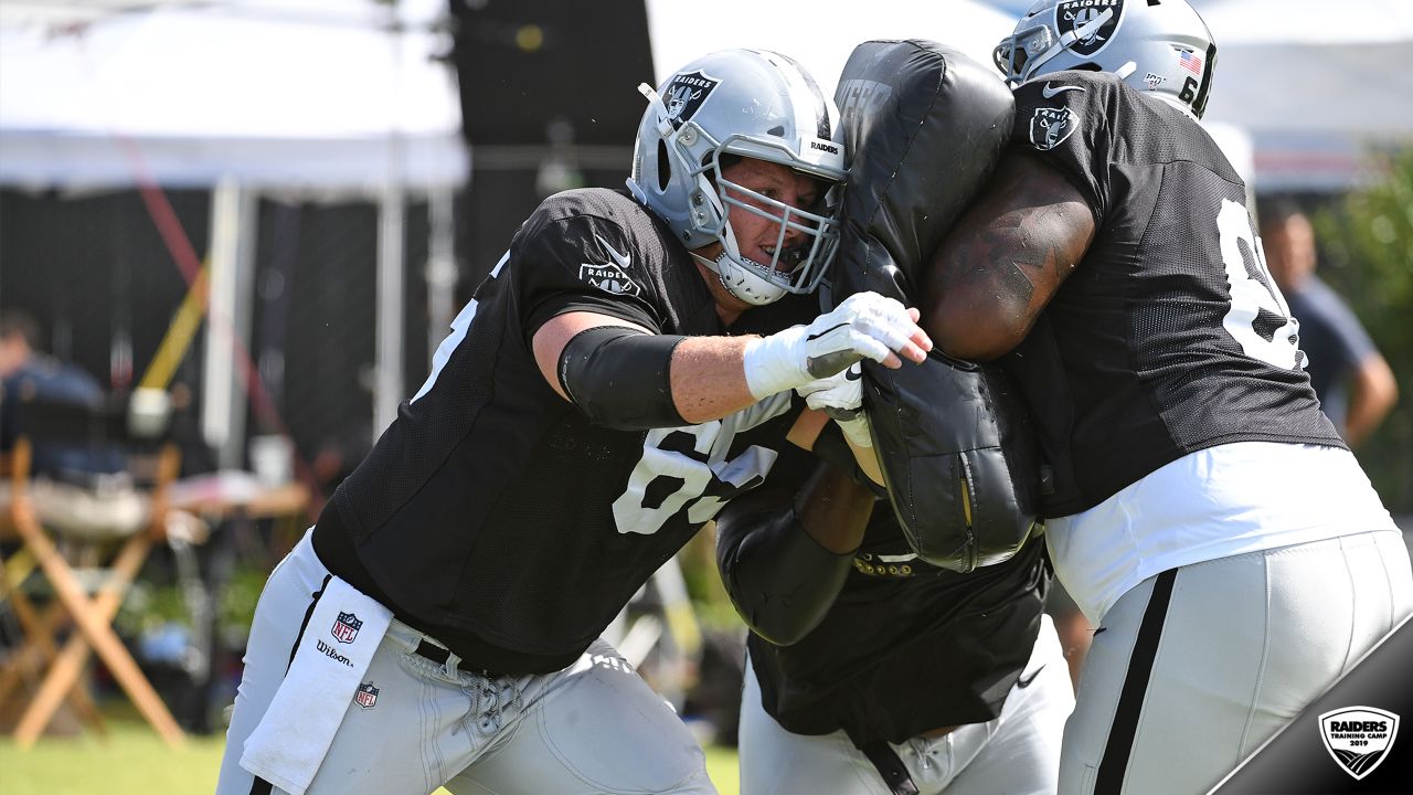 Oakland Raiders offensive guard Jordan Devey (65), center Richie Incognito  (64), and offensive …