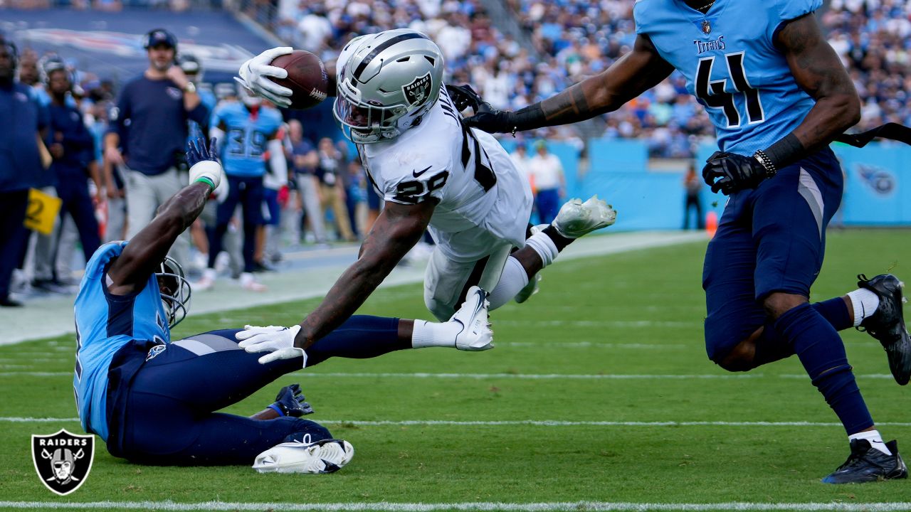 Miami Dolphins running back Malcolm Brown (34) scores a touchdown against  the Las Vegas Raiders during the first half of an NFL football game,  Sunday, Sept. 26, 2021, in Las Vegas. (AP