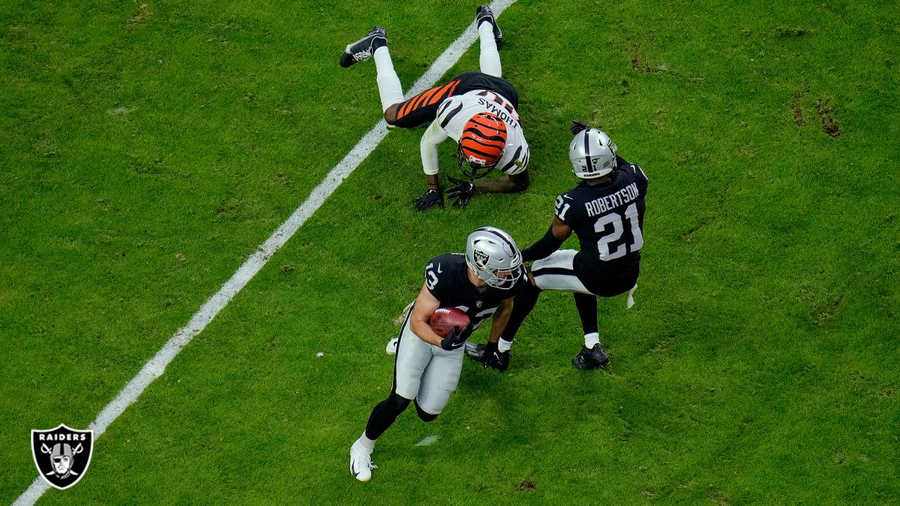 Raiders cornerback Amik Robertson (21) reacts to an early hit penalty as  Seattle Seahawks wide …