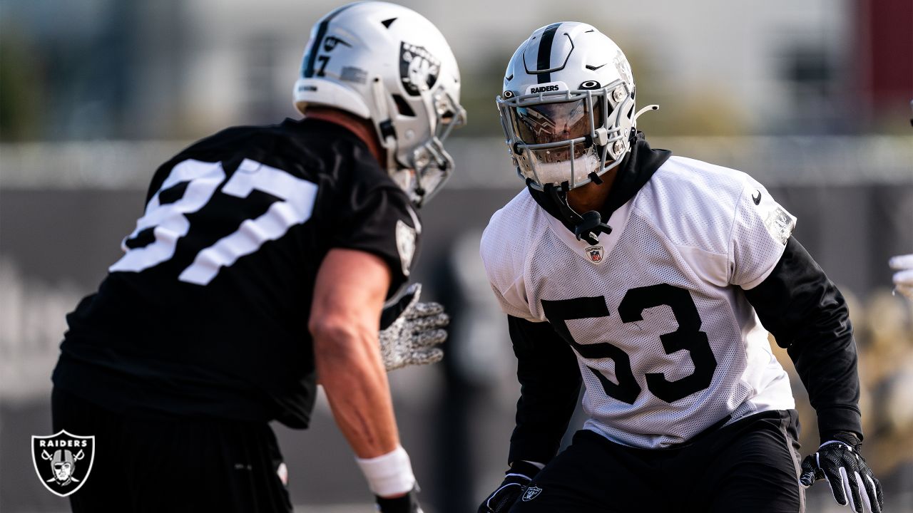 Raiders tight end Foster Moreau (87) is tackled by Raiders linebacker Javin  White (53) during a …